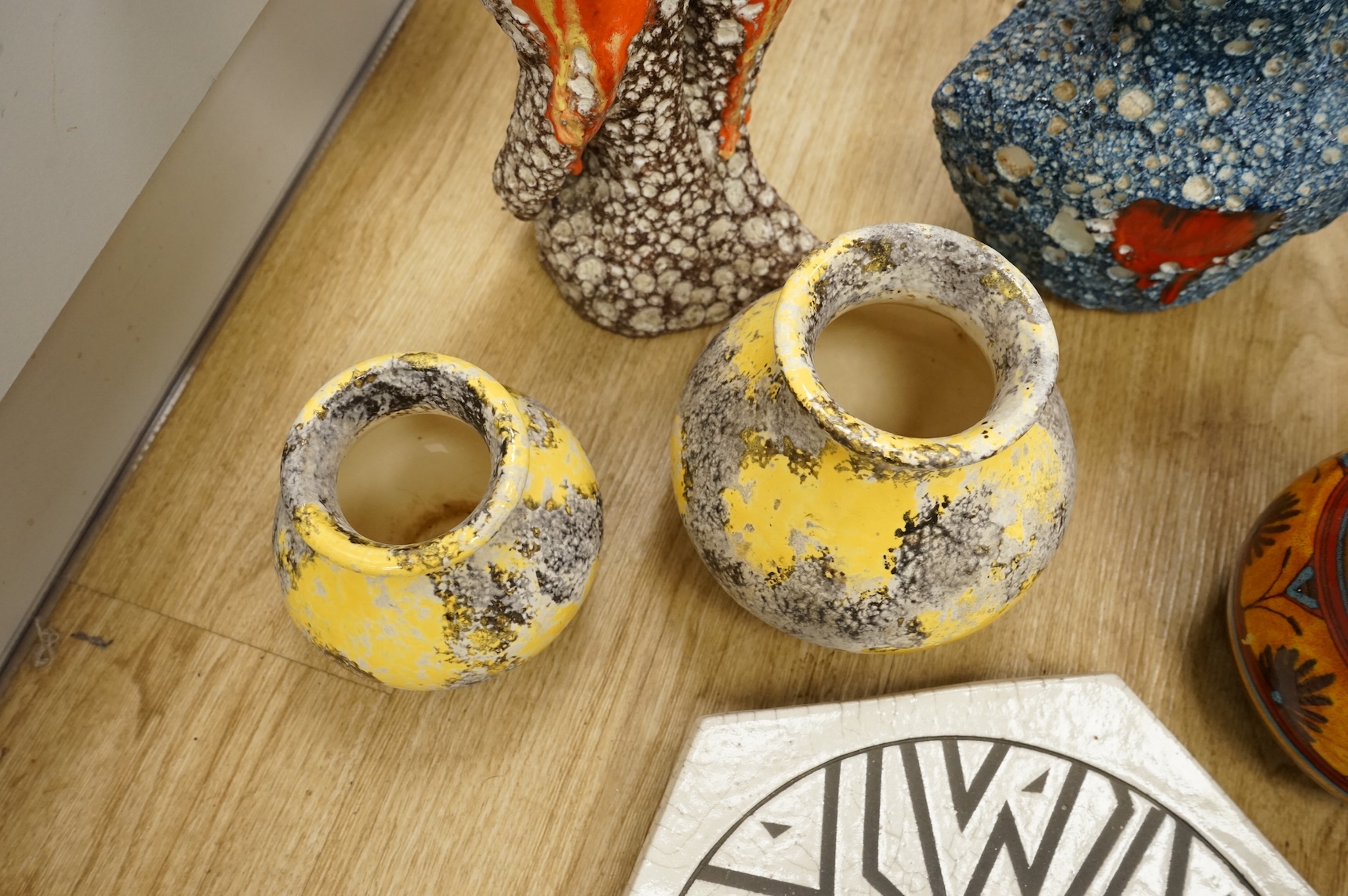 A collection of studio ceramics and pottery to include a Zsolnay vase and a Lyn Alves hexagonal dish